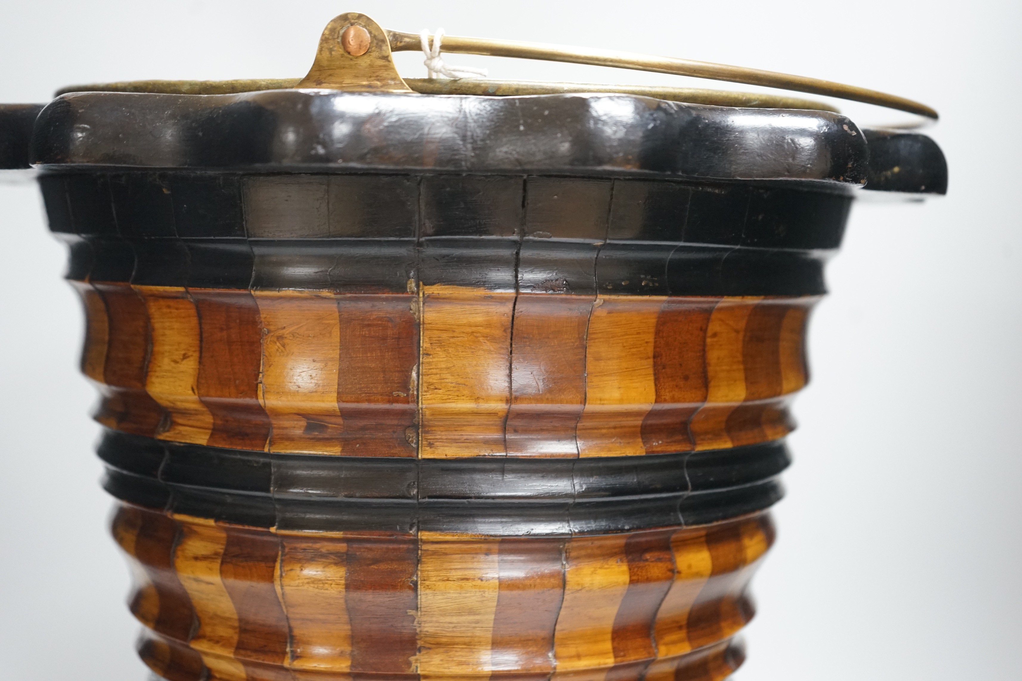 A Dutch ebonised and staved wood bucket, ‘Teestof’ 42cms high